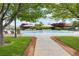 Community pool featuring lounge chairs and umbrellas for relaxation at 11408 Newton Commons Dr # 104, Las Vegas, NV 89135