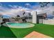 A beautiful backyard with a pool, green grass, and an exterior view of the home at , Las Vegas, NV 89145
