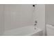 Clean white bathtub with shower and white tile surround at , Las Vegas, NV 89145