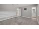 Spacious bedroom with carpet, adjacent bathroom, and a wall-mounted TV bracket at , Las Vegas, NV 89145
