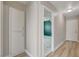 Hallway view showcasing storage and access to bedroom with ceiling fan and marble-look flooring at , Las Vegas, NV 89145