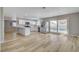 Bright open kitchen with white cabinets, stainless steel appliances, and views of the backyard pool at , Las Vegas, NV 89145