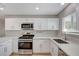 Bright kitchen featuring new appliances, quartz countertops, and sleek white cabinetry at , Las Vegas, NV 89145