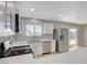 Modern kitchen with stainless steel appliances and white cabinets overlooks the backyard at , Las Vegas, NV 89145