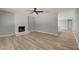 Spacious living room featuring a cozy white brick fireplace and neutral paint at , Las Vegas, NV 89145