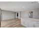 Open living room features modern flooring, fresh paint, and a large kitchen island at , Las Vegas, NV 89145