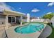 Backyard view of a private pool, covered patio and lush, green landscaping at , Las Vegas, NV 89145