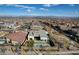 Expansive aerial view of a modern home with pool, playground, and desert landscaping in a suburban community at 12199 Canyon Sunset St, Las Vegas, NV 89138