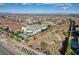 Expansive aerial view of a modern home with pool, playground, and desert landscaping in a suburban community at 12199 Canyon Sunset St, Las Vegas, NV 89138