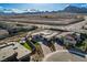 Overhead view of a modern home with a pool, cabana, turf yard, desert landscaping, and mountain views at 12199 Canyon Sunset St, Las Vegas, NV 89138