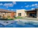 Beautiful backyard featuring a refreshing pool, playground, and green space, perfect for outdoor activities at 12199 Canyon Sunset St, Las Vegas, NV 89138
