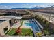 Aerial view of a backyard featuring a pool, covered patio, and ' play area at 12199 Canyon Sunset St, Las Vegas, NV 89138