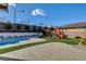 Beautiful backyard with a sparkling pool, a ' playset, and plenty of room for relaxation and recreation at 12199 Canyon Sunset St, Las Vegas, NV 89138
