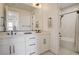 Well-lit bathroom featuring a double vanity, sleek fixtures, and walk-in shower at 12199 Canyon Sunset St, Las Vegas, NV 89138
