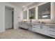 Bright bathroom featuring double vanity with modern fixtures, sleek lines, and neutral tones at 12199 Canyon Sunset St, Las Vegas, NV 89138