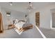 Bedroom featuring a minimalist aesthetic with connecting en suite, natural light, and neutral tones at 12199 Canyon Sunset St, Las Vegas, NV 89138
