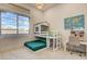 bedroom with bunk bed and workspace next to a window with a view at 12199 Canyon Sunset St, Las Vegas, NV 89138