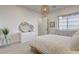 A bright bedroom featuring a queen bed, modern decor, and ample natural light at 12199 Canyon Sunset St, Las Vegas, NV 89138