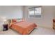 Bright bedroom with modern furnishings, textured bedding, and a view to the yard at 12199 Canyon Sunset St, Las Vegas, NV 89138