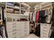 Walk-in closet with custom shelving, drawers, and ample storage space for clothes and accessories at 12199 Canyon Sunset St, Las Vegas, NV 89138
