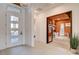 Welcoming entryway with a modern front door, leading to a bright interior and a glimpse of the office at 12199 Canyon Sunset St, Las Vegas, NV 89138