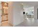 Open hallway leading to a stylish powder room and a bright, inviting living area at 12199 Canyon Sunset St, Las Vegas, NV 89138