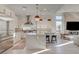 Gourmet kitchen featuring a large center island, stainless appliances, and modern pendant lighting at 12199 Canyon Sunset St, Las Vegas, NV 89138
