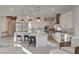 Contemporary kitchen featuring stainless steel appliances, bar stool seating and modern lighting at 12199 Canyon Sunset St, Las Vegas, NV 89138