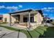 Covered patio featuring a dining area, outdoor kitchen, and grill, perfect for al fresco dining and entertaining at 12199 Canyon Sunset St, Las Vegas, NV 89138
