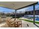 Enjoy outdoor dining on this patio with a built-in grill, a large table, and serene backyard scenery at 12199 Canyon Sunset St, Las Vegas, NV 89138
