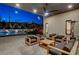 Cozy outdoor living space with comfortable seating, a ceiling fan and a view of the pool and play area at 12199 Canyon Sunset St, Las Vegas, NV 89138