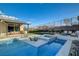 Inviting backyard pool and spa with an outdoor kitchen and seating area for relaxing and entertaining at 12199 Canyon Sunset St, Las Vegas, NV 89138