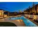 Beautiful pool and spa with landscaped backyard, including lighting and privacy wall at 12199 Canyon Sunset St, Las Vegas, NV 89138