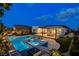 Stunning backyard with a modern pool, spa, patio, outdoor kitchen and manicured landscaping at 12199 Canyon Sunset St, Las Vegas, NV 89138