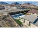 Aerial view of a modern home featuring a private pool, spa, playground, covered patio, and mountain views at 12199 Canyon Sunset St, Las Vegas, NV 89138