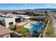 Aerial view of backyard, featuring pool, spa, play area, and covered patio dining at 12199 Canyon Sunset St, Las Vegas, NV 89138