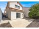 Back of home shows covered patio and nice yard with mature tree at 1405 Sycamore Spring Ct, Las Vegas, NV 89128