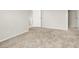 Bright bedroom with neutral walls and plush carpeting throughout at 1405 Sycamore Spring Ct, Las Vegas, NV 89128
