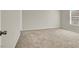 Spacious bedroom features soft carpeting, neutral paint and natural light at 1405 Sycamore Spring Ct, Las Vegas, NV 89128