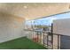 Comfortable balcony with artificial turf and a view of the community parking lot and surrounding mountains at 1405 Vegas Valley Dr # 236, Las Vegas, NV 89169
