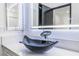 Close-up of a bathroom with a stylish vessel sink and designer faucet set against a quartz countertop at 1405 Vegas Valley Dr # 236, Las Vegas, NV 89169