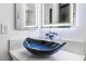 Modern bathroom highlighting a unique vessel sink with stylish fixtures and dual illuminated mirrors at 1405 Vegas Valley Dr # 236, Las Vegas, NV 89169