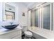 Stylish bathroom featuring a vessel sink, illuminated mirror, and a combined shower and tub with tiled walls at 1405 Vegas Valley Dr # 236, Las Vegas, NV 89169