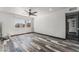 Inviting bedroom with a ceiling fan, and large window, offering natural light and views of the surrounding neighborhood at 1405 Vegas Valley Dr # 236, Las Vegas, NV 89169