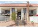 Apartment building with charming red tile roofs and well-manicured front yard with a small decorative tree at 1405 Vegas Valley Dr # 236, Las Vegas, NV 89169