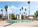 Community pool surrounded by lush palm trees and well-maintained landscaping, perfect for relaxation at 1405 Vegas Valley Dr # 236, Las Vegas, NV 89169
