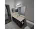 Bathroom with single sink vanity, updated fixtures, and neutral paint at 1621 Sandecker Ct # 104, Las Vegas, NV 89146