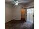 Bedroom with neutral gray carpet, ceiling fan, closet, and sliding door to the patio at 1621 Sandecker Ct # 104, Las Vegas, NV 89146