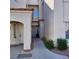 Inviting condo entrance with a well-kept walkway and attractive architectural details at 1621 Sandecker Ct # 104, Las Vegas, NV 89146