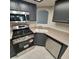 Updated kitchen with stainless steel appliances, neutral countertops and tile flooring at 1621 Sandecker Ct # 104, Las Vegas, NV 89146